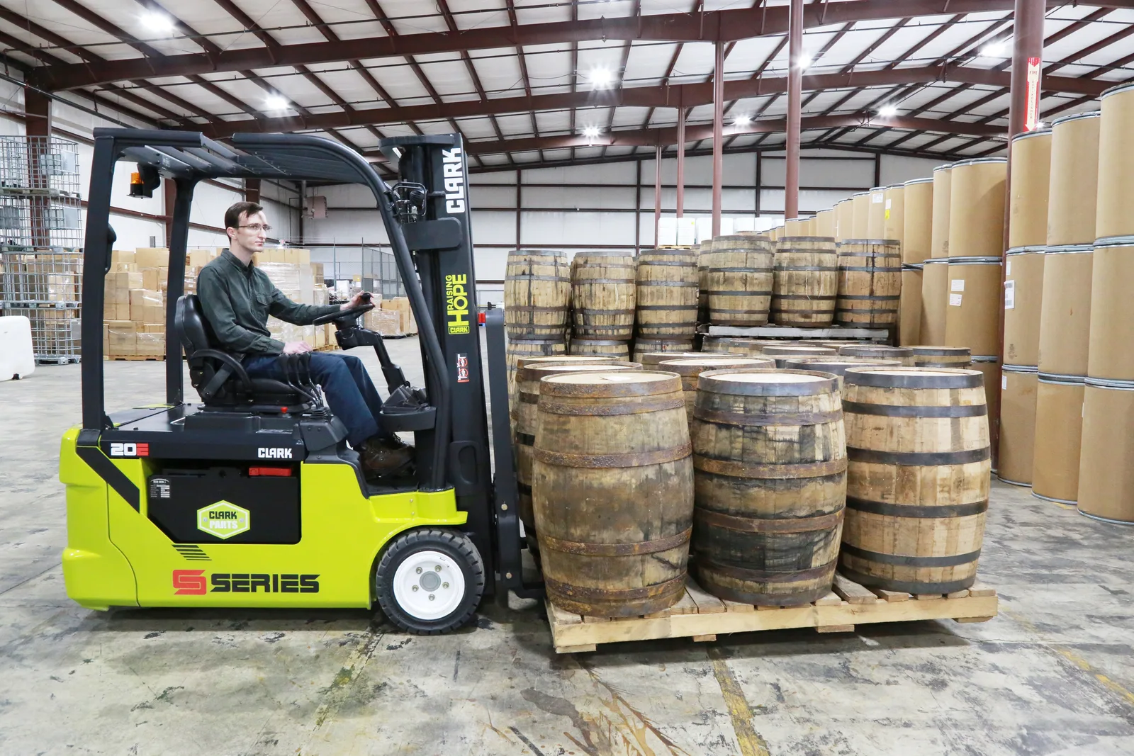Electric forklift moving barrels in a Lehigh Valley warehouse