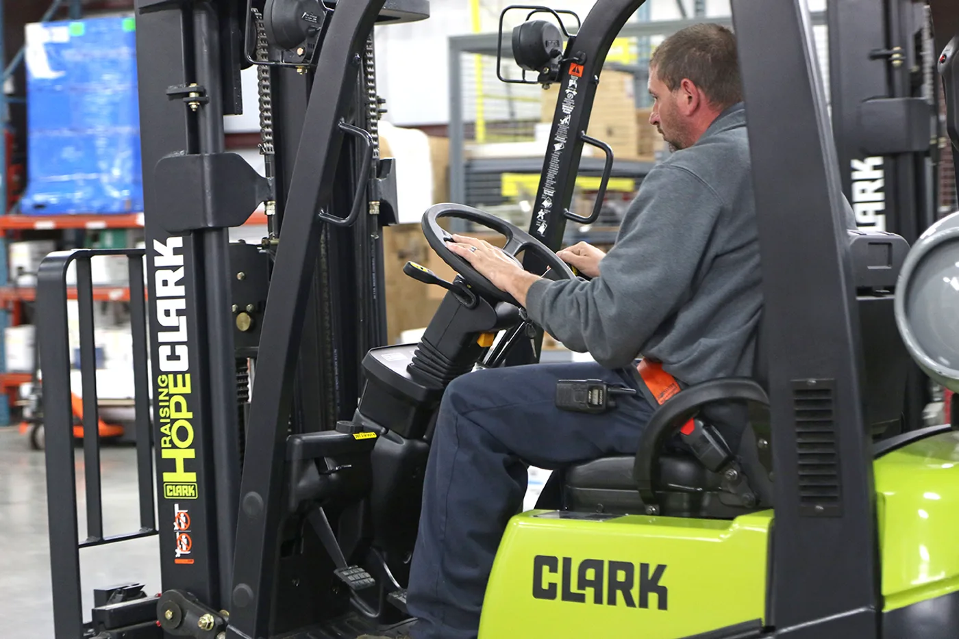 Operator at the controls of a forklift in a Lehigh Valley warehouse