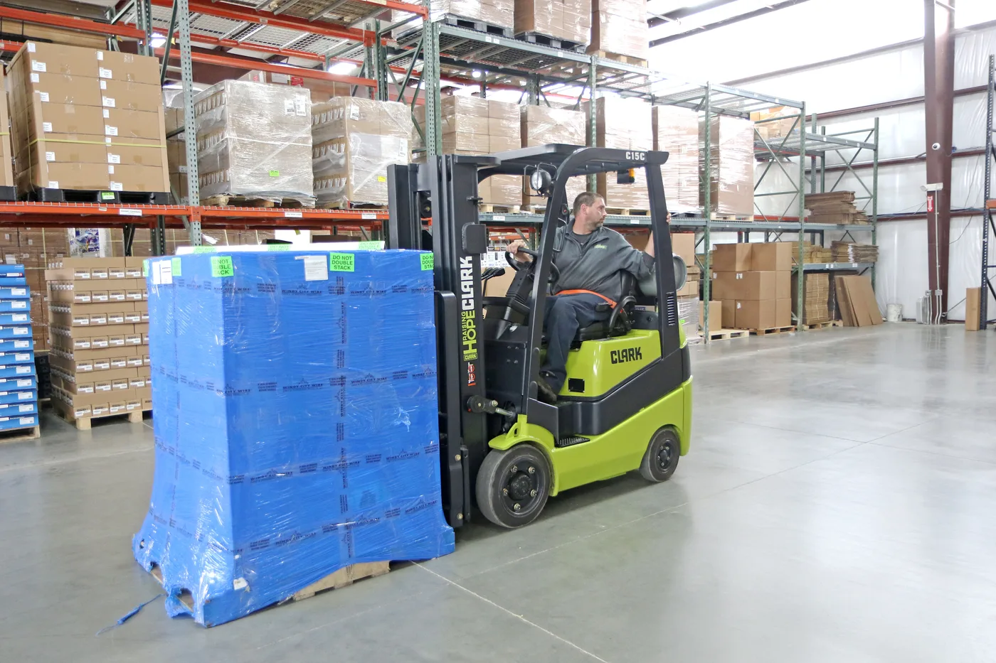 Used Clark cushion tire forklift moving a pallet in a Lehigh Valley warehouse